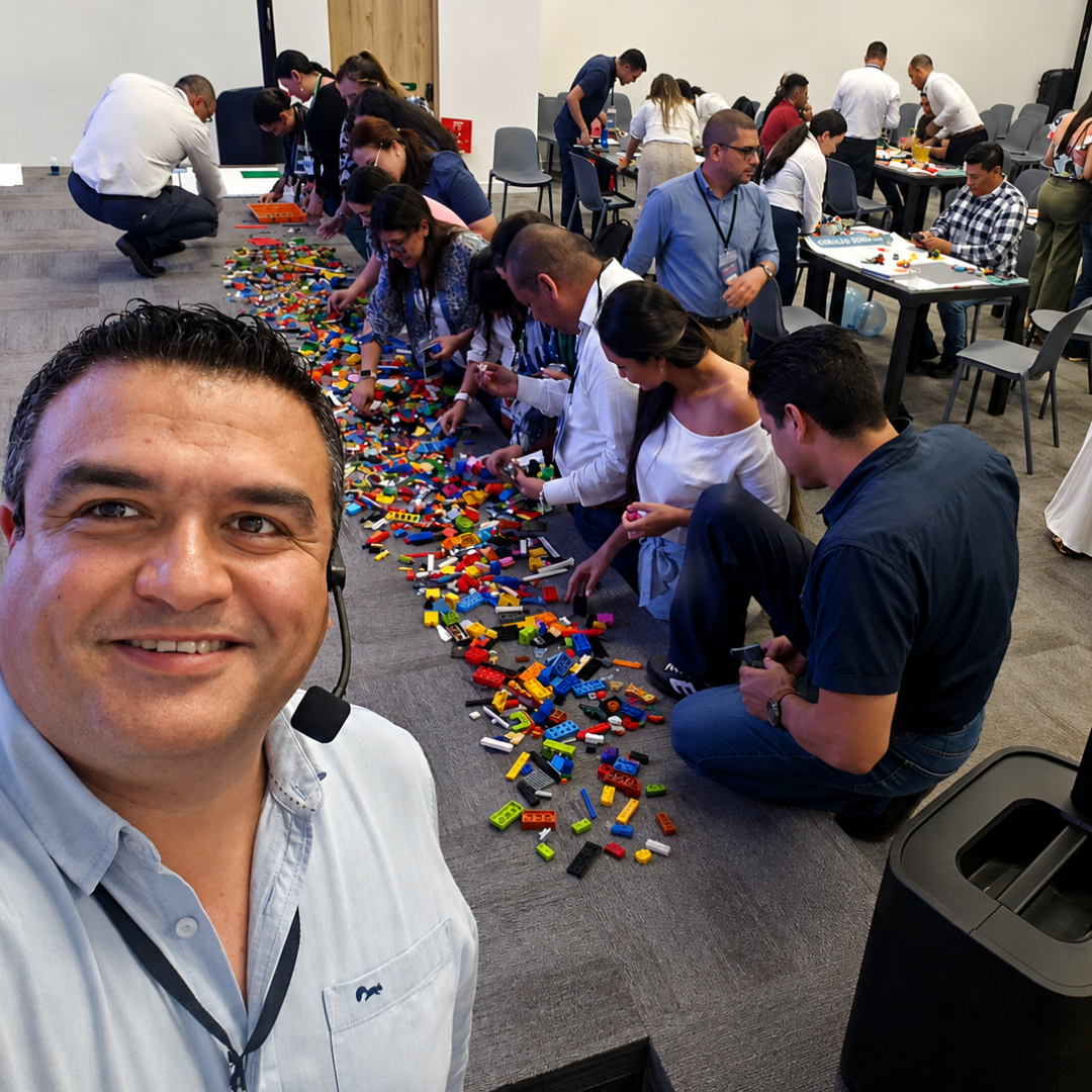 Taller con equipos trabajando con piezas LEGO® sobre el piso